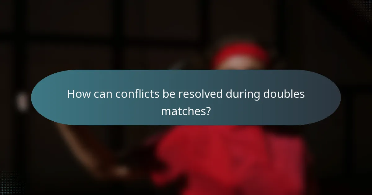 How can conflicts be resolved during doubles matches?