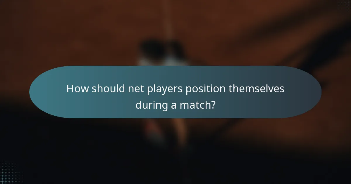 How should net players position themselves during a match?