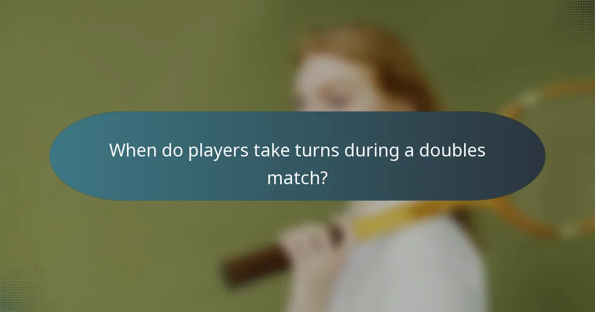 When do players take turns during a doubles match?